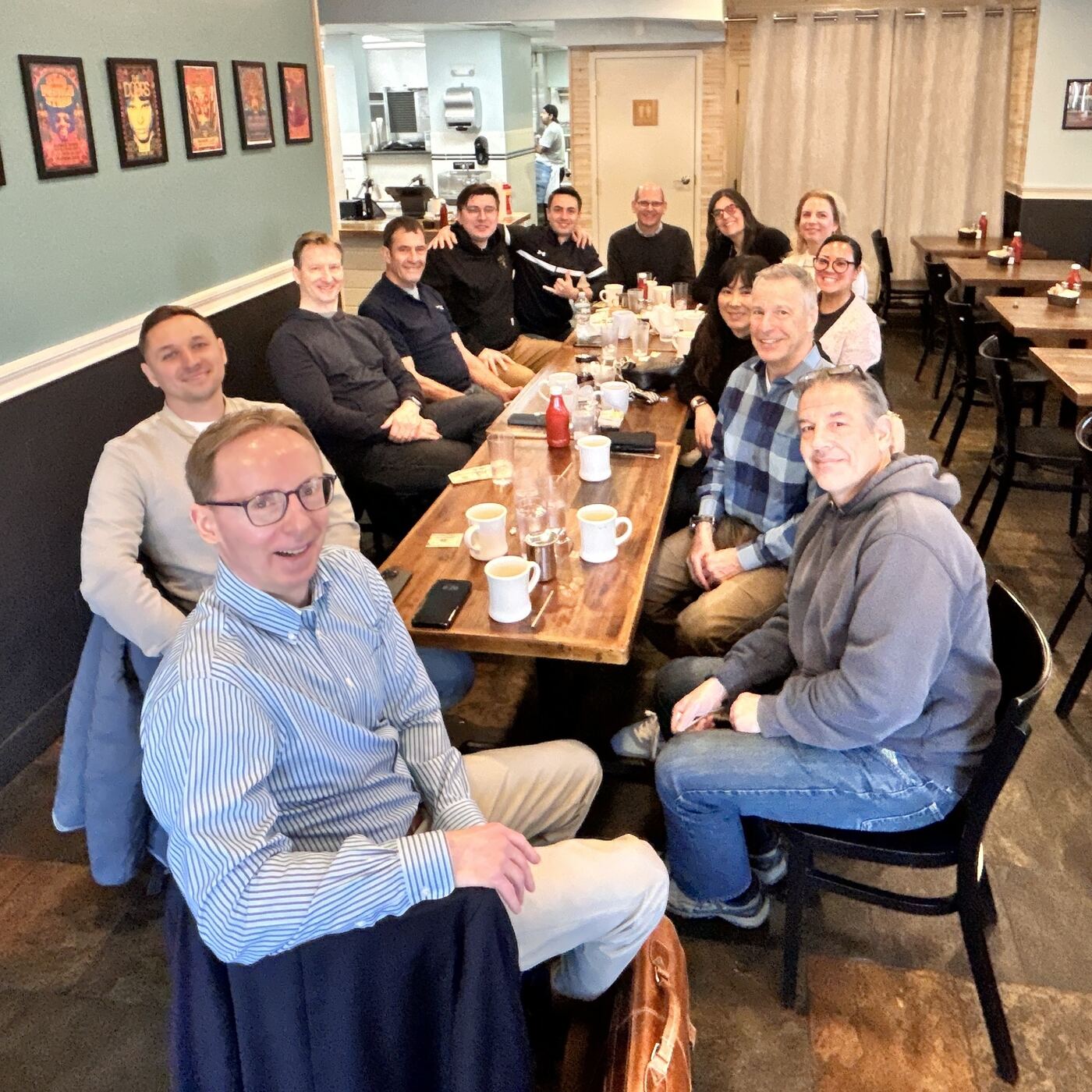 BNI Brookline Networkers members sharing coffee and conversation around a restaurant table